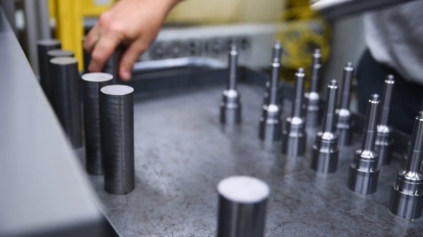 Operator loading/unloading parts in a drawer unit.