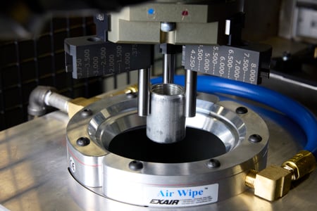 Part being placed in part blowoff system