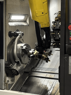 Close up of Dimension Machine's CNC machine with robotic arm